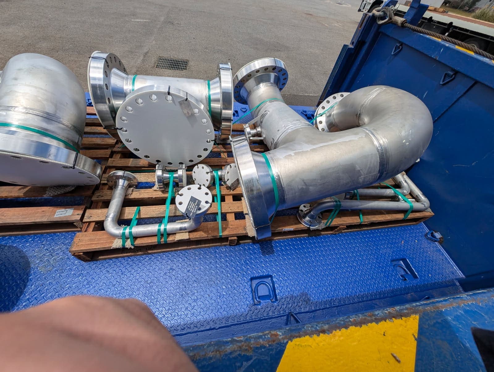 Duplex spools with painted structural steel supports alongside