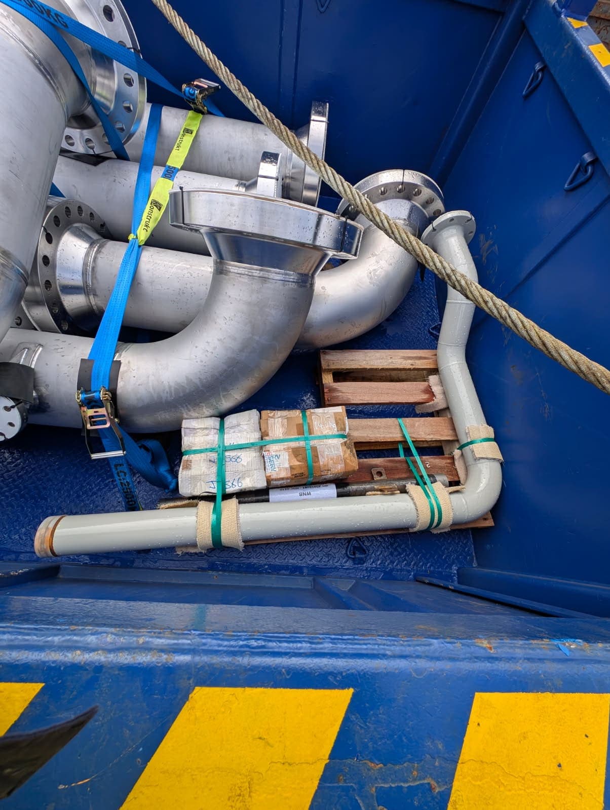 Fabricated duplex piping laid out in the shipping frame