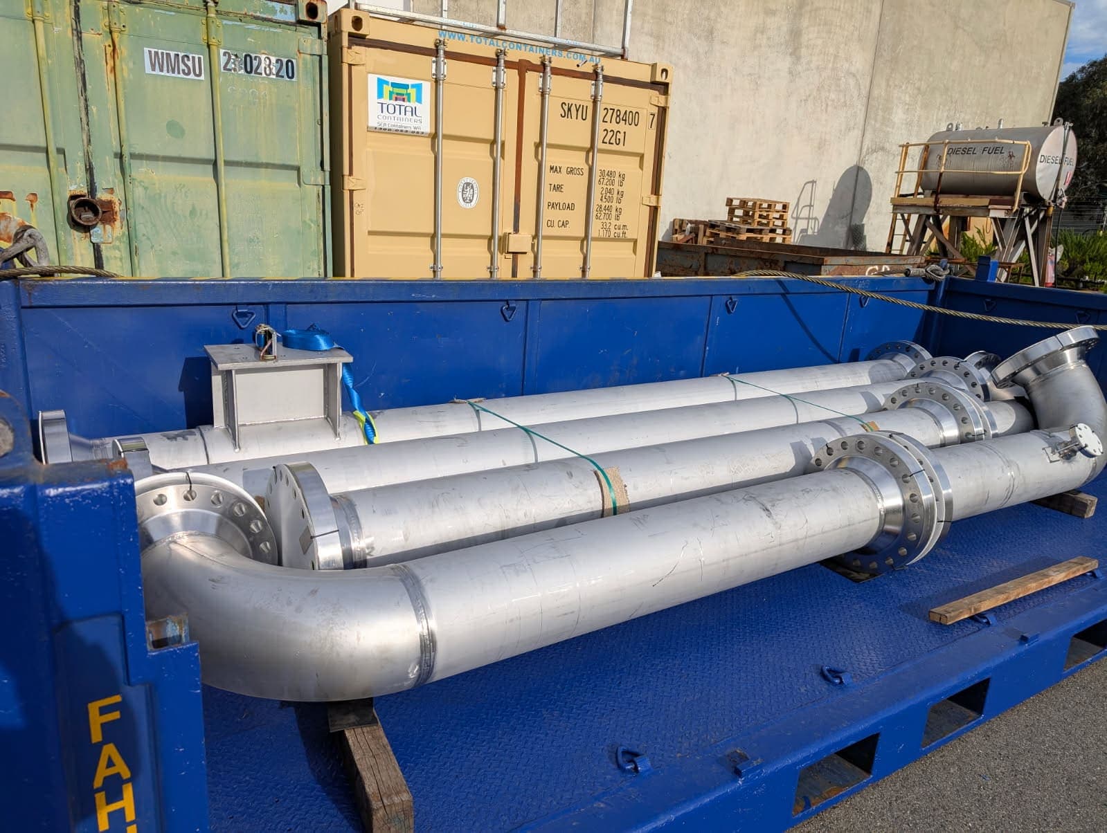 Duplex piping package strapped and braced for road transport