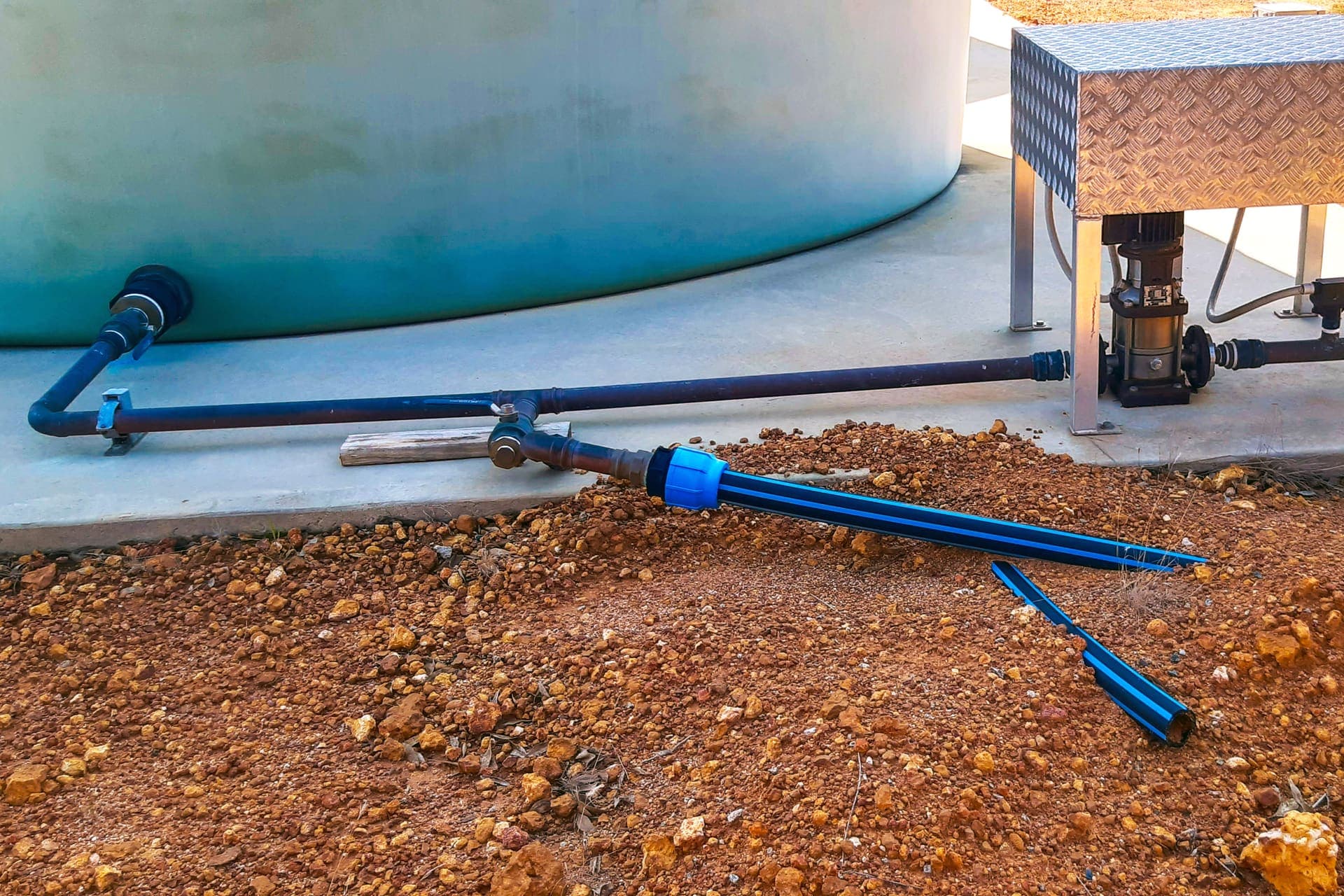 Pump set and pipework connected to the tank with new HDPE poly line at the fill point