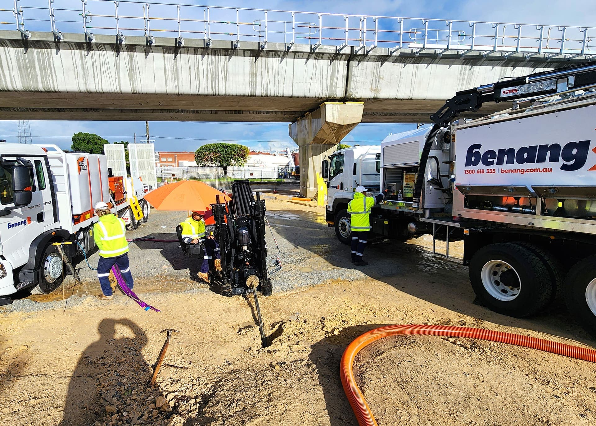 Benang crew directional drilling beside the vac truck under the rail bridge at the Western Power works