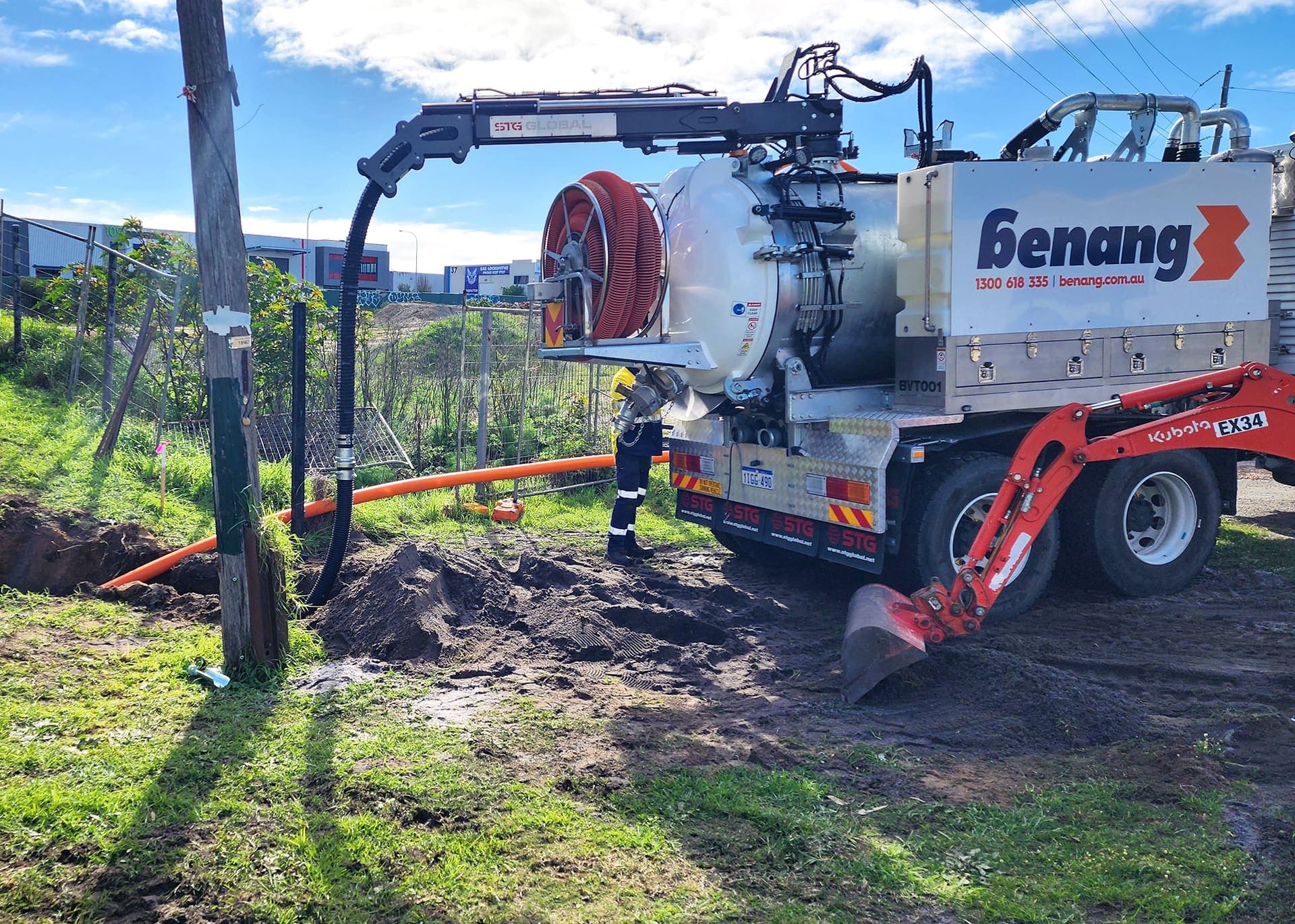 Benang vac excavation truck with its hose reel exposing live services beside a power pole