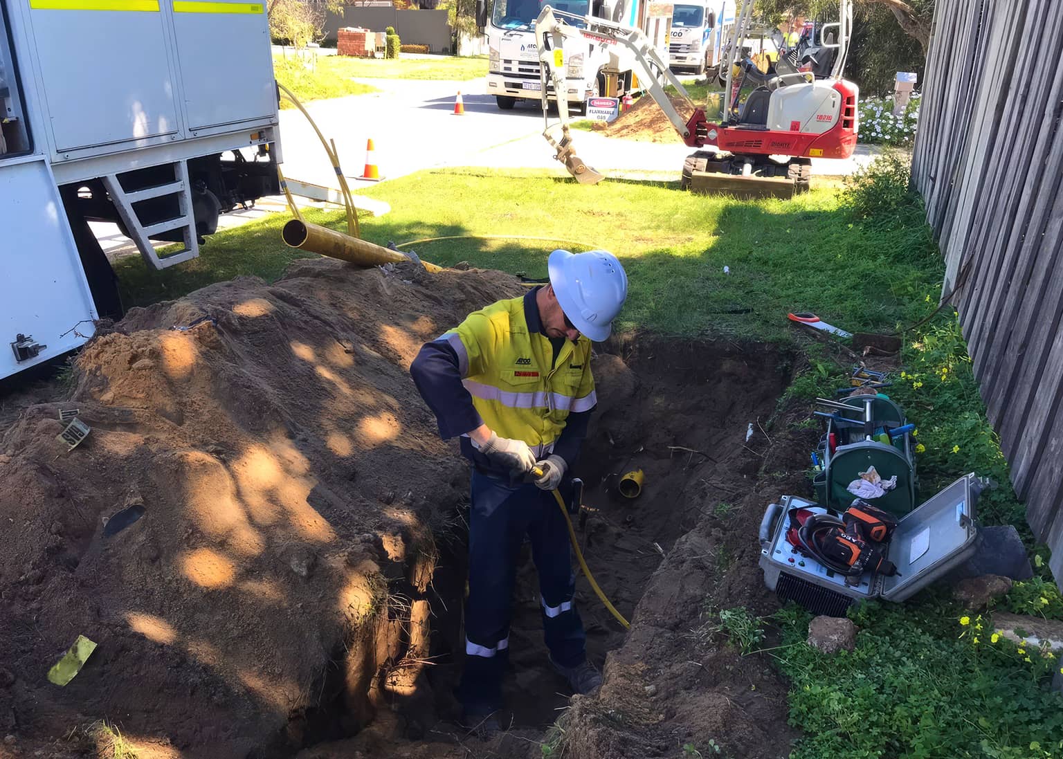 Gas service connection works beside a boundary fence