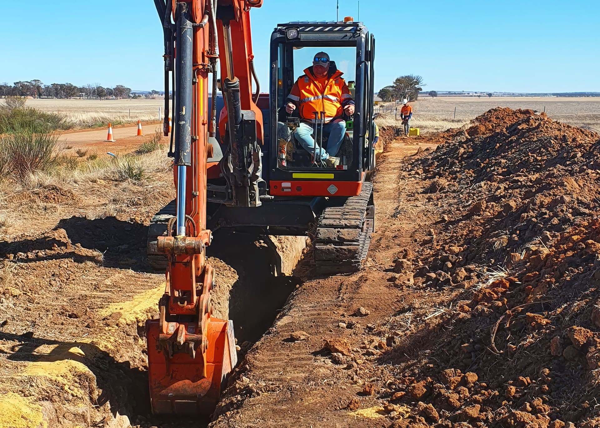 New PVC main being laid and jointed in the trench at Babakin