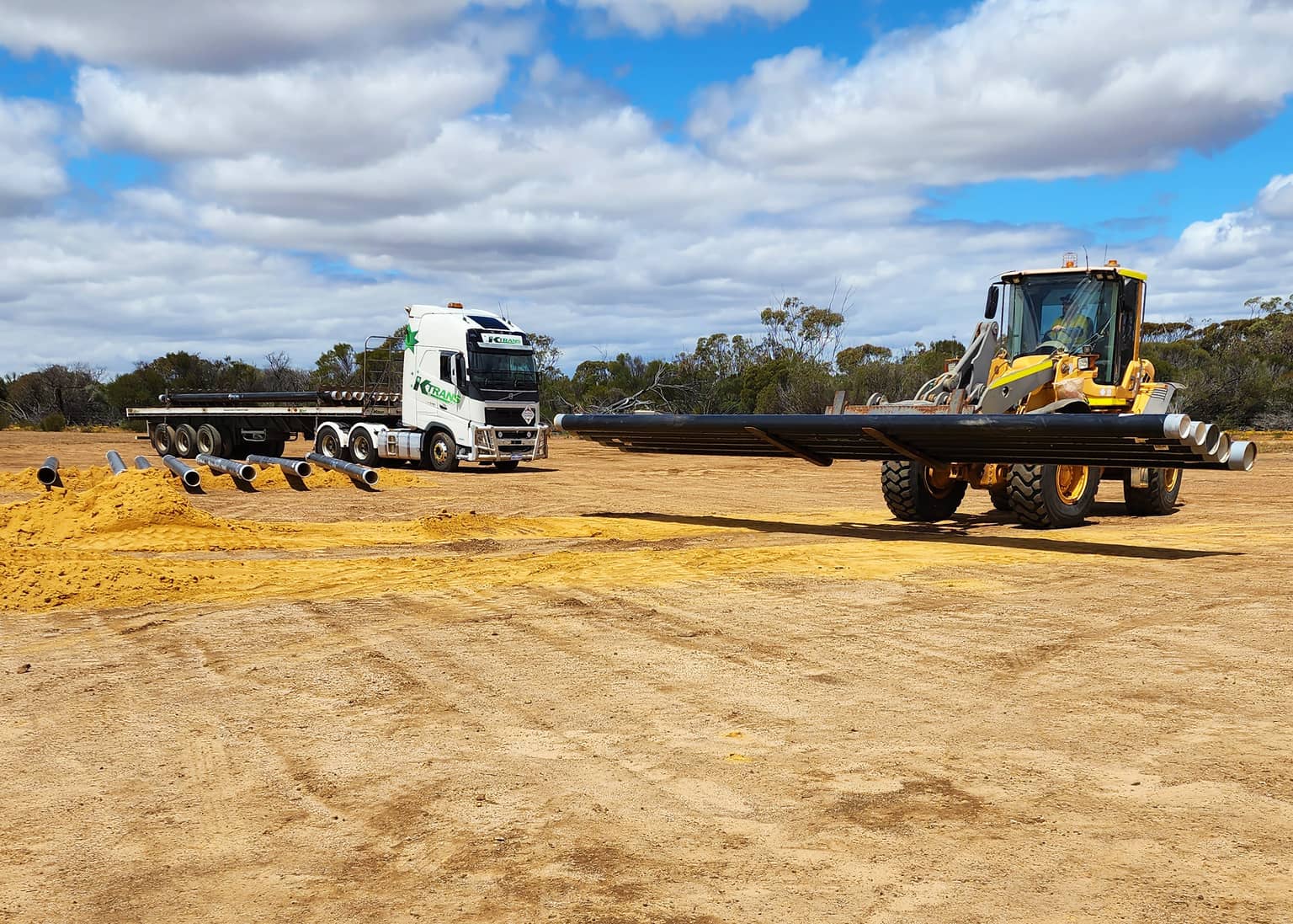 Pipe deliveries arriving along the alignment