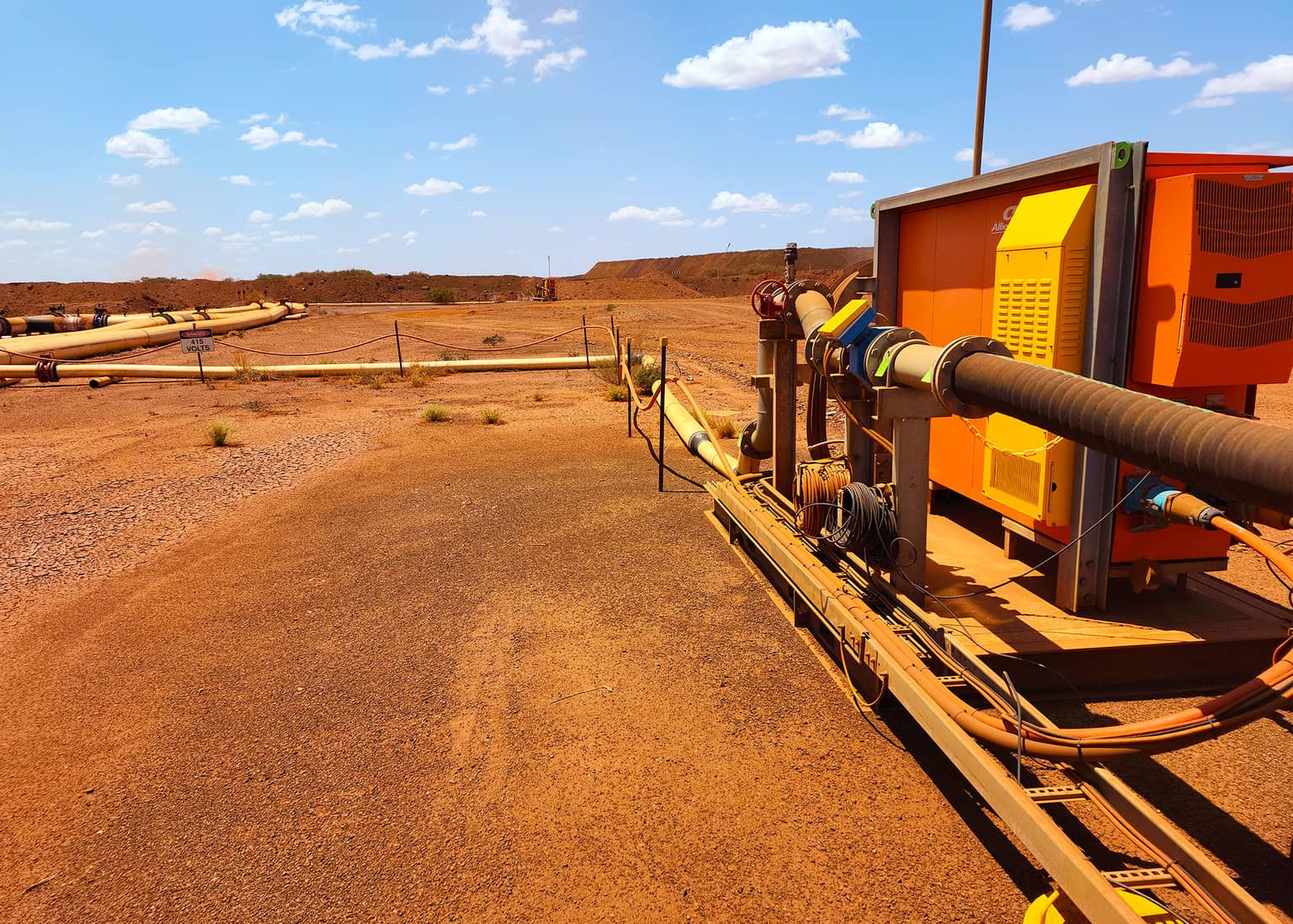 Dewatering pipeline running alongside the site access road