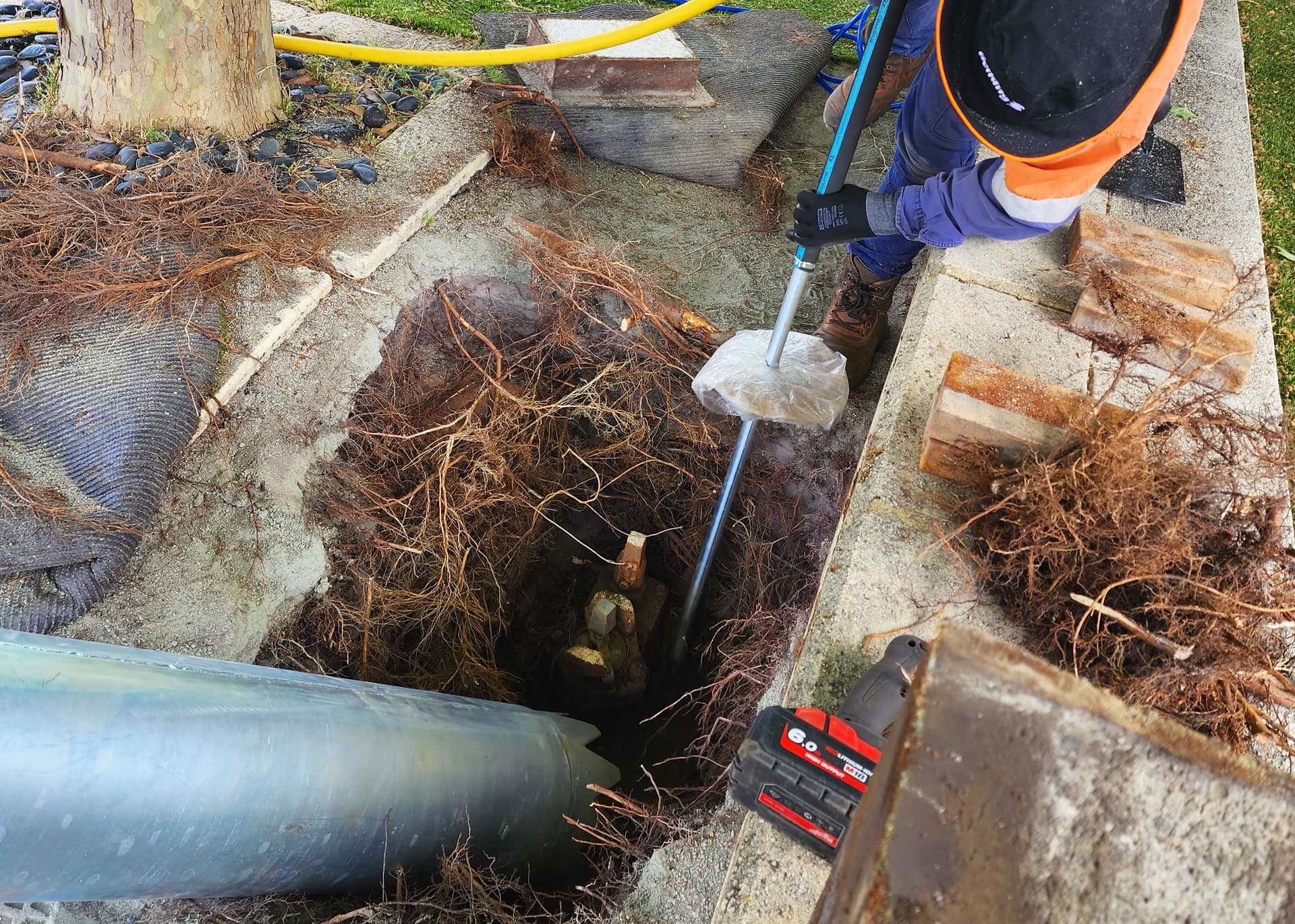 Panel crew working a brownfield excavation among existing services