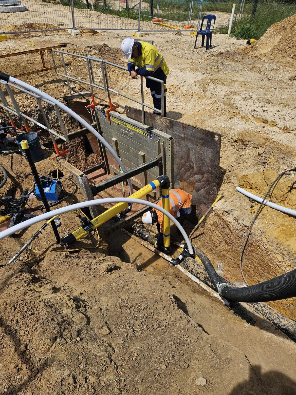 Benang workers installing conduit at a shored bore pit for the Rottnest Island cable upgrades