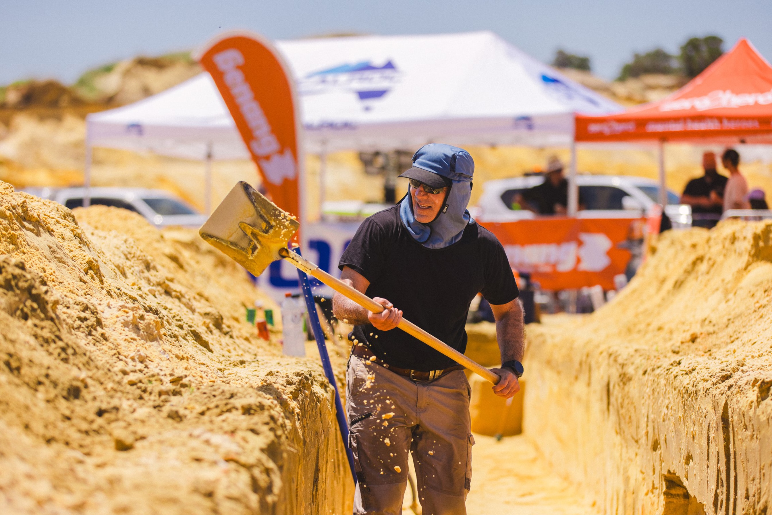 Benang team member hand digging a trench at The Big Dig charity event
